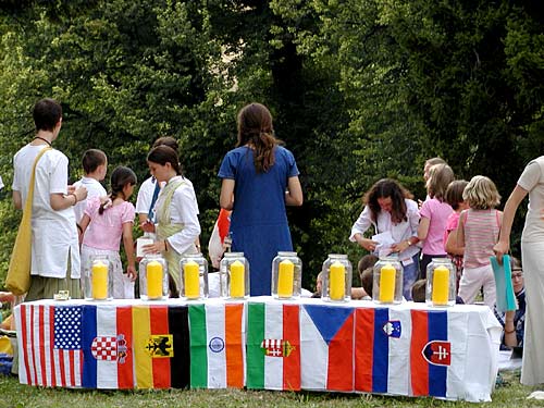 A flag and a candle for each participating country