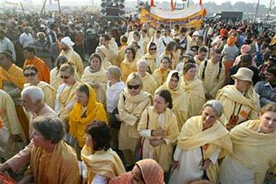 Devotees from Yoga in Daily Life participate in a procession on the banks of the River Ganges during the Ardh Kumbha Mela in Allahabad, India, Tuesday, Jan. 9, 2007 ((c) Associated Press)