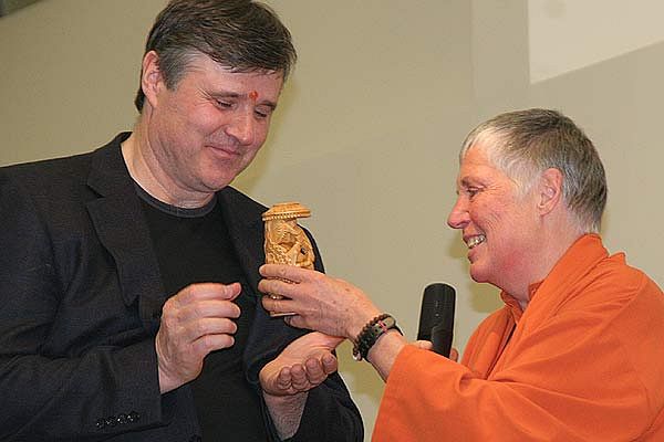 Inauguration of the new yoga centre in Ljubljana - Vlado Paradiznik, president of the Yoga in Daily Life Society from Ljubljana excepts a gift from the Vienna yoga centre